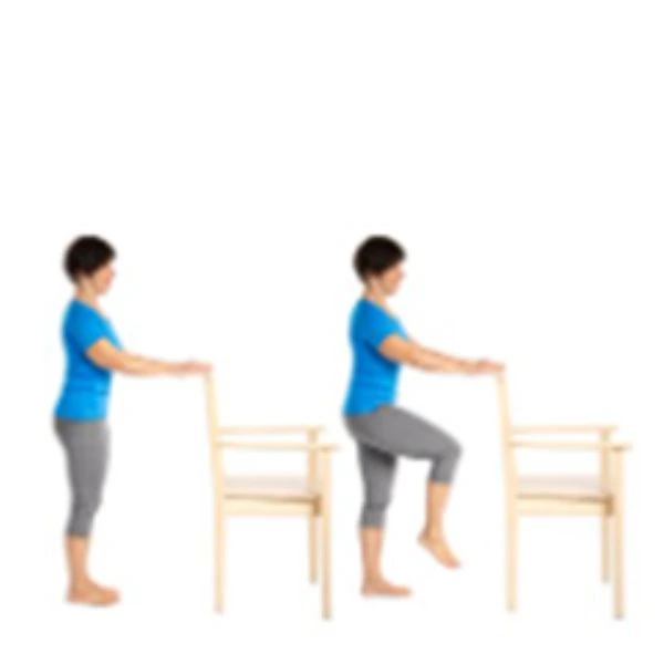 person demonstrating a standing knee lift with support